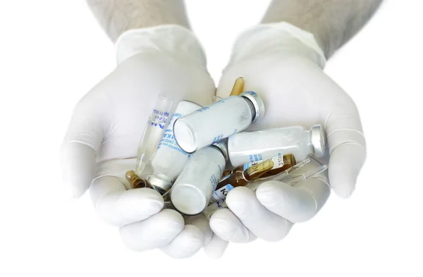 Φαρμάκων στα χέρια. απομονωθεί σε λευκό — Φωτογραφία Αρχείου