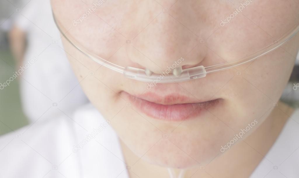 Breathing through a plastic nasal catheter during illness — Stock Photo © sudok1 22888934