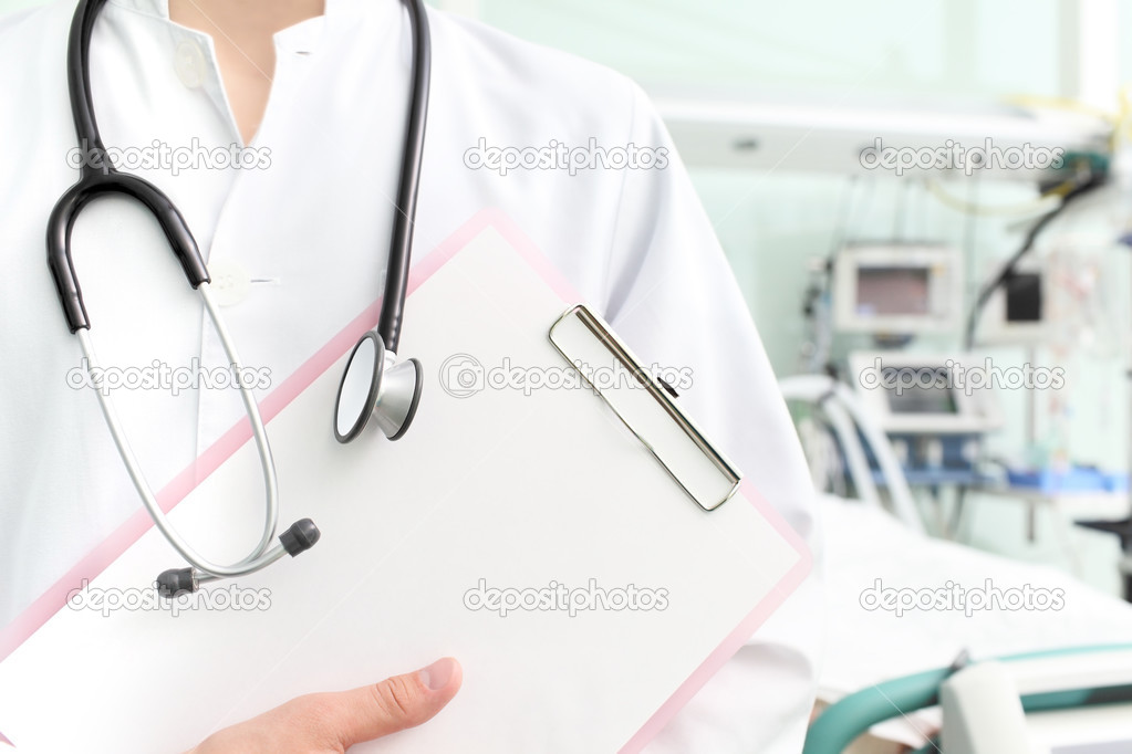 Doctor with clipboard and stethoscope in hospital