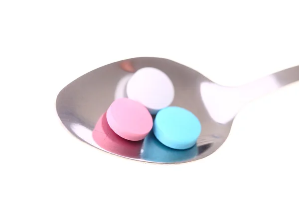 Pills on a spoon. — Stock Photo, Image
