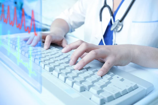 Doctor work with cardiogram on a transparent screen — Stock Photo, Image
