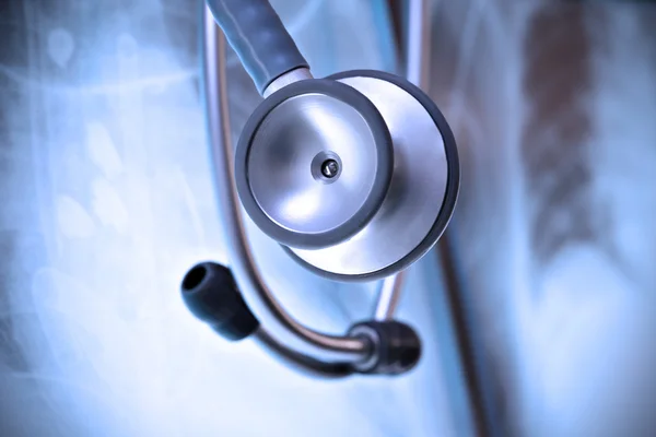 Stethoscope on a background X-ray images — Stock Photo, Image