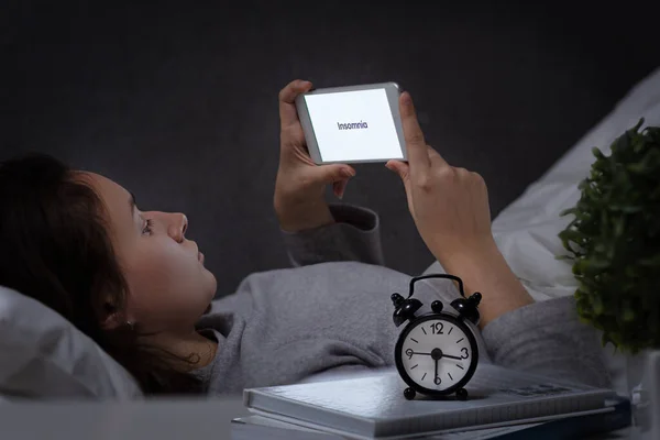 Woman Bed Uses Smartphone Night Insomnia Inscription Bright Screen Stockfoto