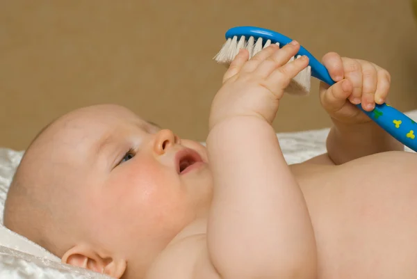 Bebê com escova Fotografia De Stock