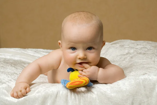 Baby met speelgoed Stockfoto