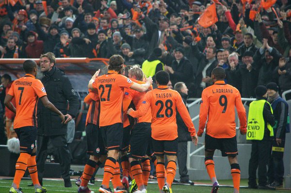 Shakhtar footballers celebrate after scoring the ball