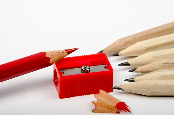 Group of wooden pencils and red sharpener — Stock Photo, Image