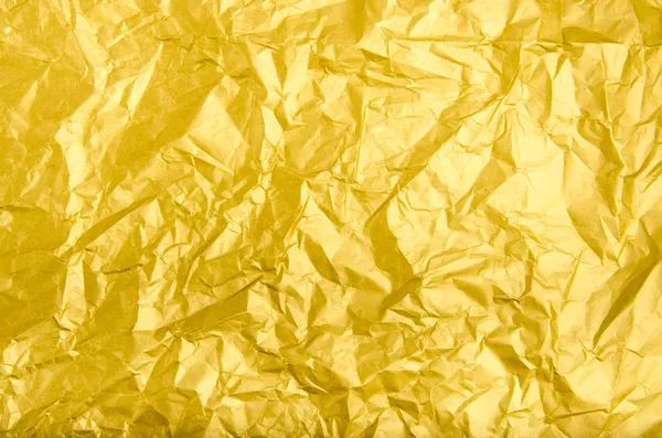 Textur und Hintergrund des faltigen goldenen Papiers — Stockfoto