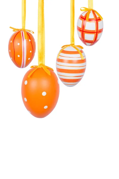 Group of hanging Easter eggs on a white background — Stock Photo, Image