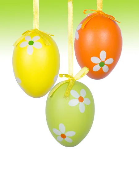 Group of hanging Easter eggs on a white background — Stock Photo, Image