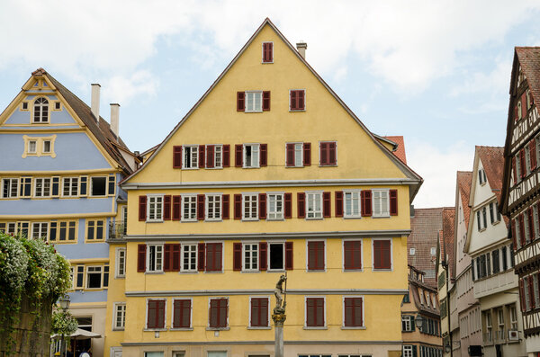 TUBINGEN, GERMANY - JULY 28, 2013: Tubingen is a traditional university town in Germany. The highlights of old town include its narrow alleyways and well-maintained traditional half-timbered houses.