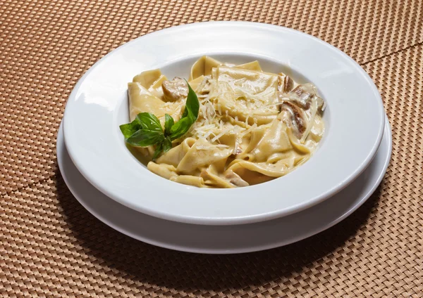 Paste with mushrooms and cheese — Stock Photo, Image