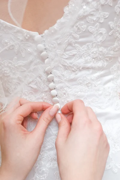 Putting on wedding dress — Stock Photo, Image