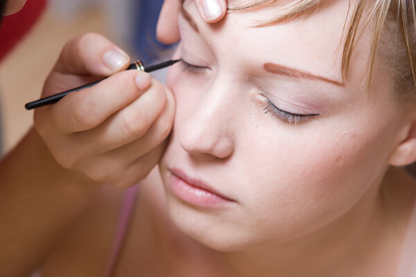 young woman directs a make-up in the morning
