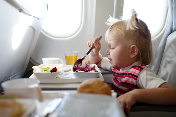 Eating in the airplane — Stock Photo, Image