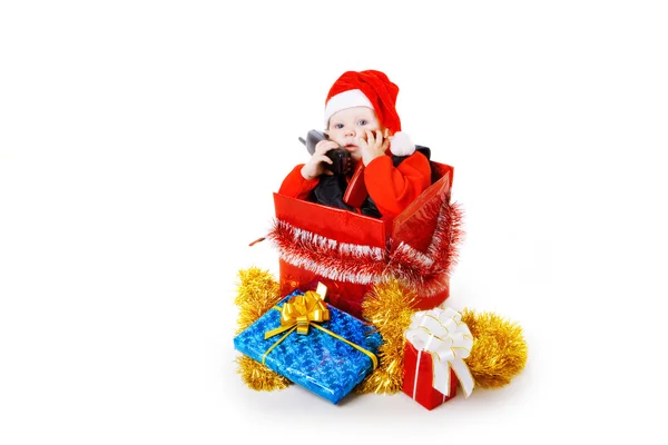 Infant calling by phone in the christmas box — Stock Photo, Image