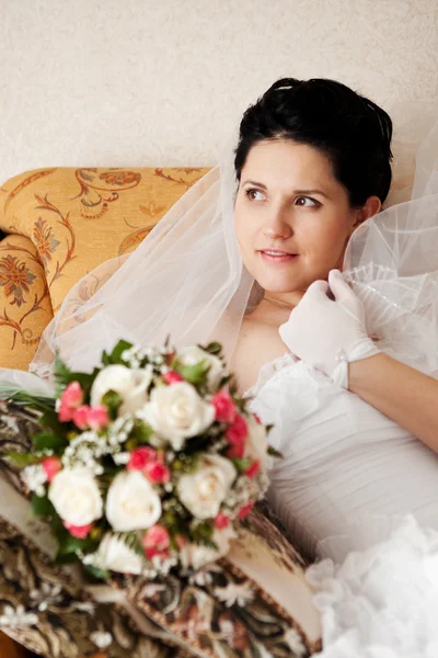 Happy bride on the sofa — Stock Photo, Image