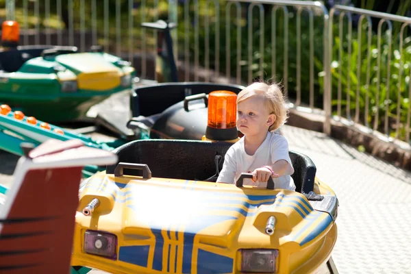 Child on the attraction — Stock Photo, Image