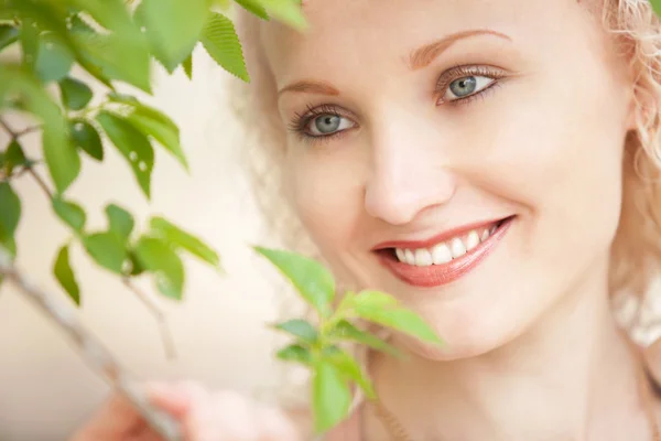 Beautiful girl with tree branch — Stock Photo, Image