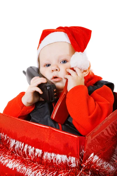 Infant calling by phone in the christmas box — Stock Photo, Image