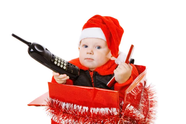 Bebek Noel kutusuna telefonla arıyor — Stok fotoğraf