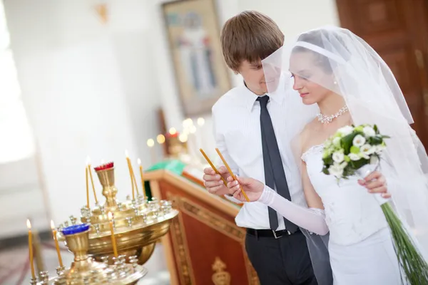 Bride and groom in the church — Stock Photo, Image