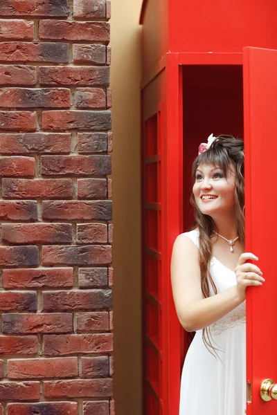 Bride in the telephone cabin — Stock Photo, Image