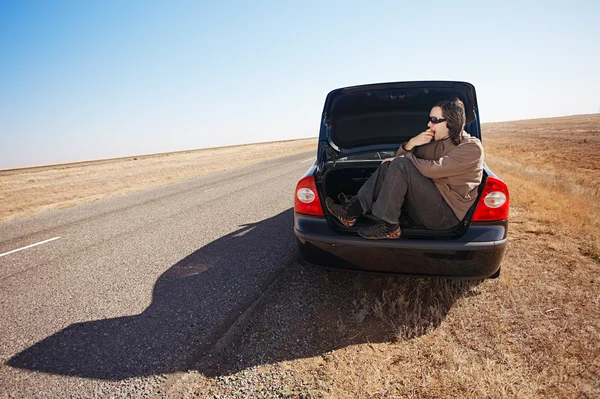 Man in trunk of car — Stock Photo, Image