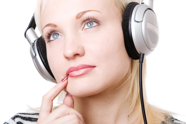 A pensive girl in headphones — Stock Photo, Image