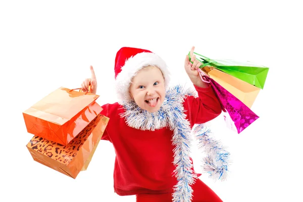 Kind verkleed als santa met presenteert — Stockfoto