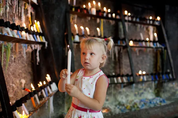 Child with candles — Stock Photo, Image