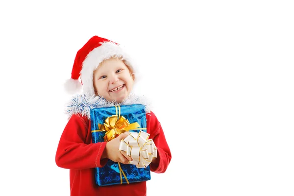 Kind mit Weihnachtsgeschenken — Stockfoto