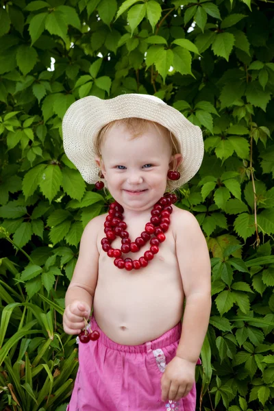 Girl and cherries — Stock Photo, Image