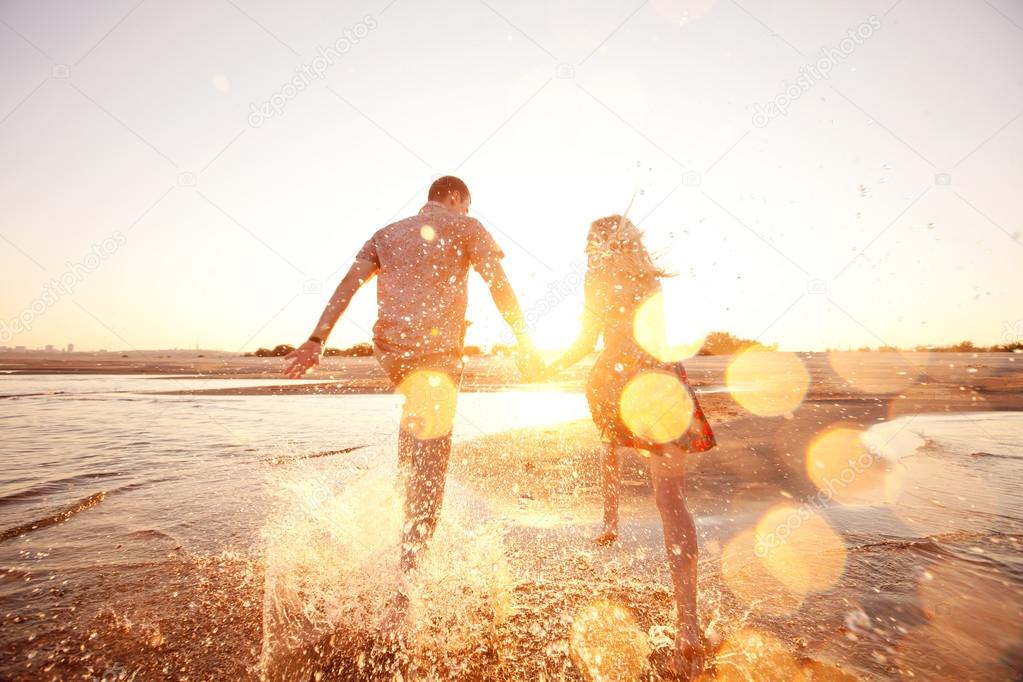 couple running on the beach