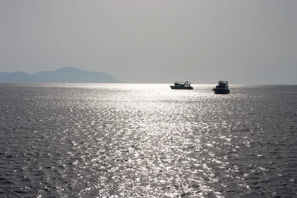 Nigth meeting of two small ships — Stock Photo, Image