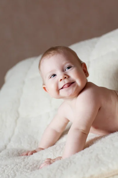 Portrait of a baby on the bed — Stock Photo, Image