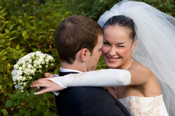 Bride hugging groom — Stock Photo, Image