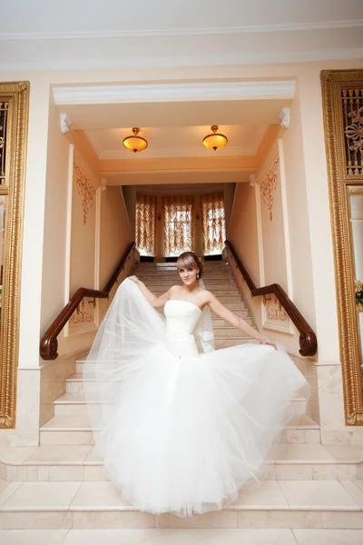 Bride in hall with staircase — Stock Photo, Image