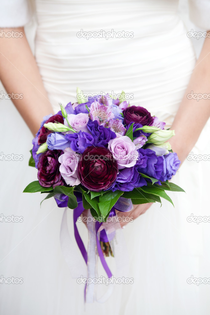 hands on wedding bouquet