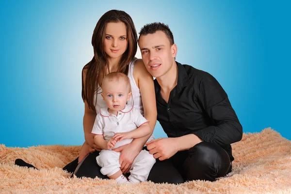 Young family with baby — Stock Photo, Image