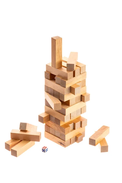 Jenga tower made of wooden blocks falling on white background — Stock Photo, Image