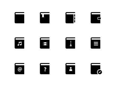 Beyaz arka plan üzerinde kitap simgeleri.