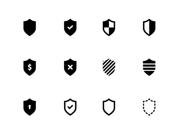 Ícones de escudo no fundo branco . — Vetor de Stock