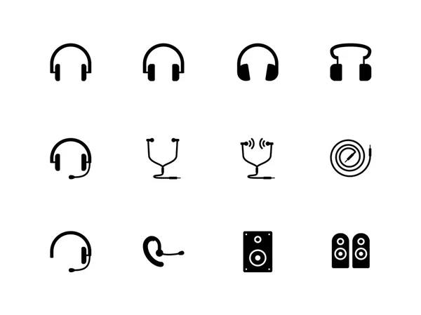 Auriculares e iconos de altavoces sobre fondo blanco . Gráficos vectoriales