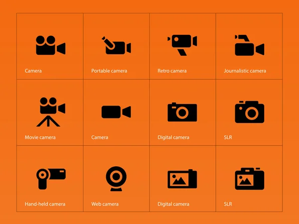 Иконки камер на оранжевом фоне . — стоковый вектор