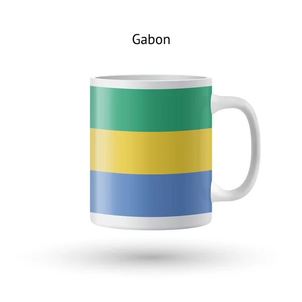 Tazza souvenir bandiera Gabon su sfondo bianco . — Vettoriale Stock