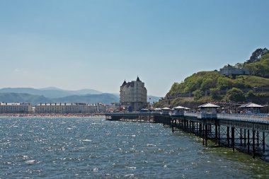Llandudno pier in Wales UK, on a bright sunny day clipart