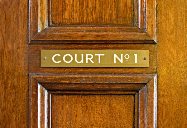 Oak door leading into court — Stock Photo, Image