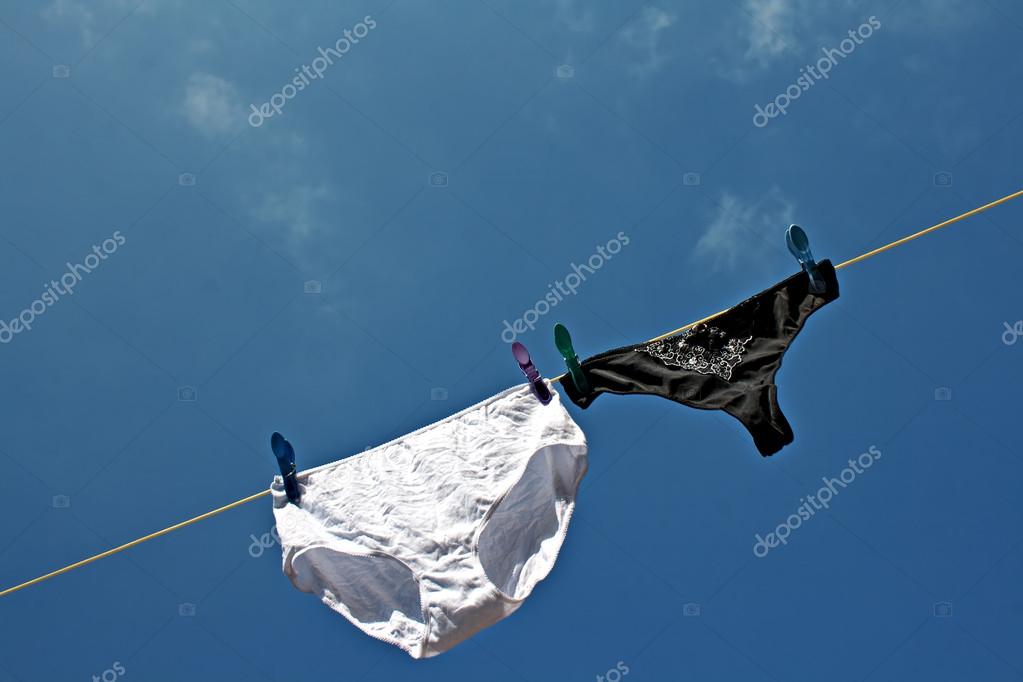 Panties hanging on washing line to dry — Stock Photo © illu 21796799