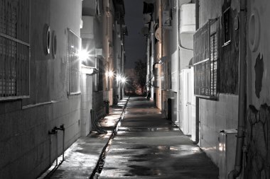Dark back alley on a wet night clipart